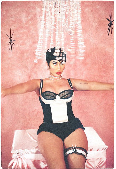 Woman in lingerie against pink backdrop
