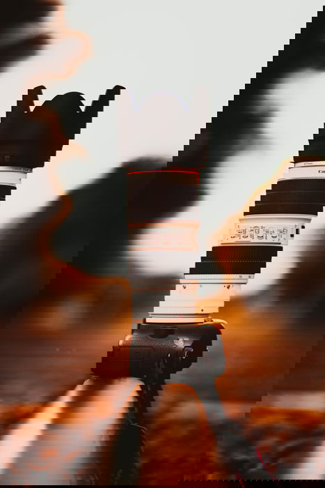 Canon DSLR camera with a telephoto lens