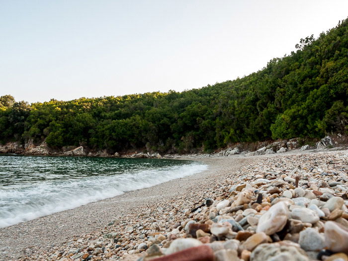 Waves breaking on the shore of Avlaki beach in Kerkyra Greece with little motion blur in the waves